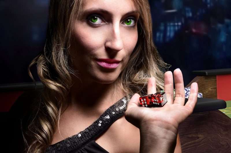 Person Holding Dices