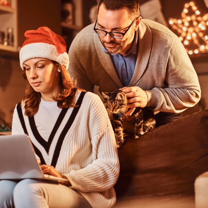 married couple using laptop