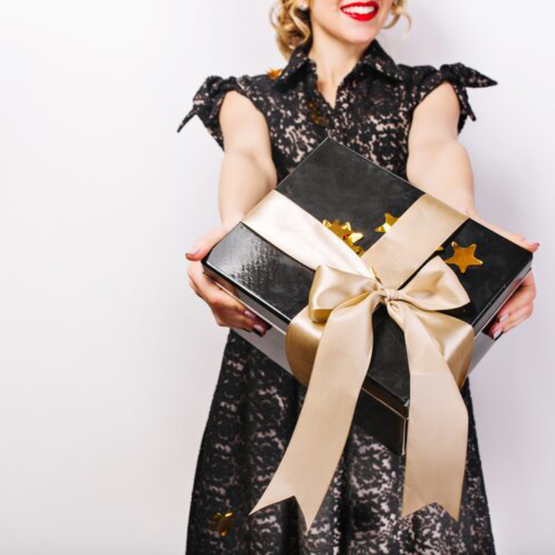 Black gift box her hands red lips black dress surprise emotion