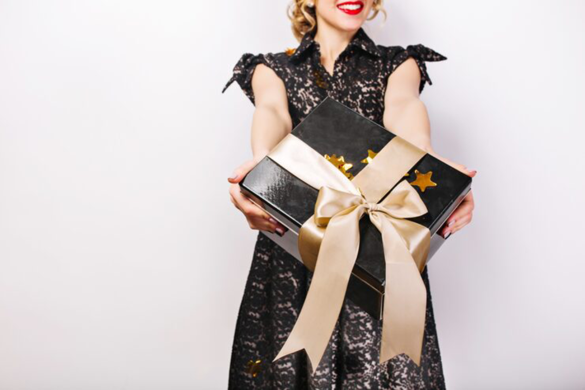 Black gift box her hands red lips black dress surprise emotion