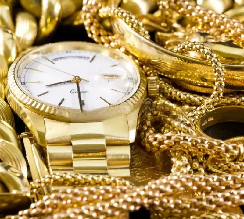 Close-up shot of a variety of jewelry, including watches