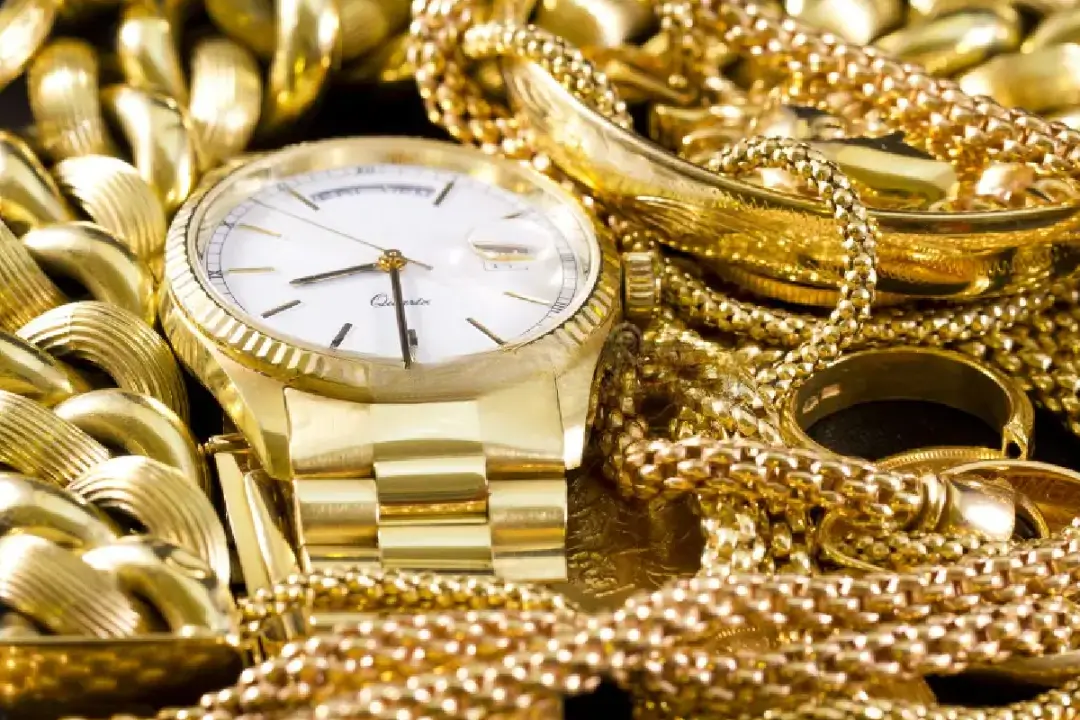 Close-up shot of a variety of jewelry, including watches