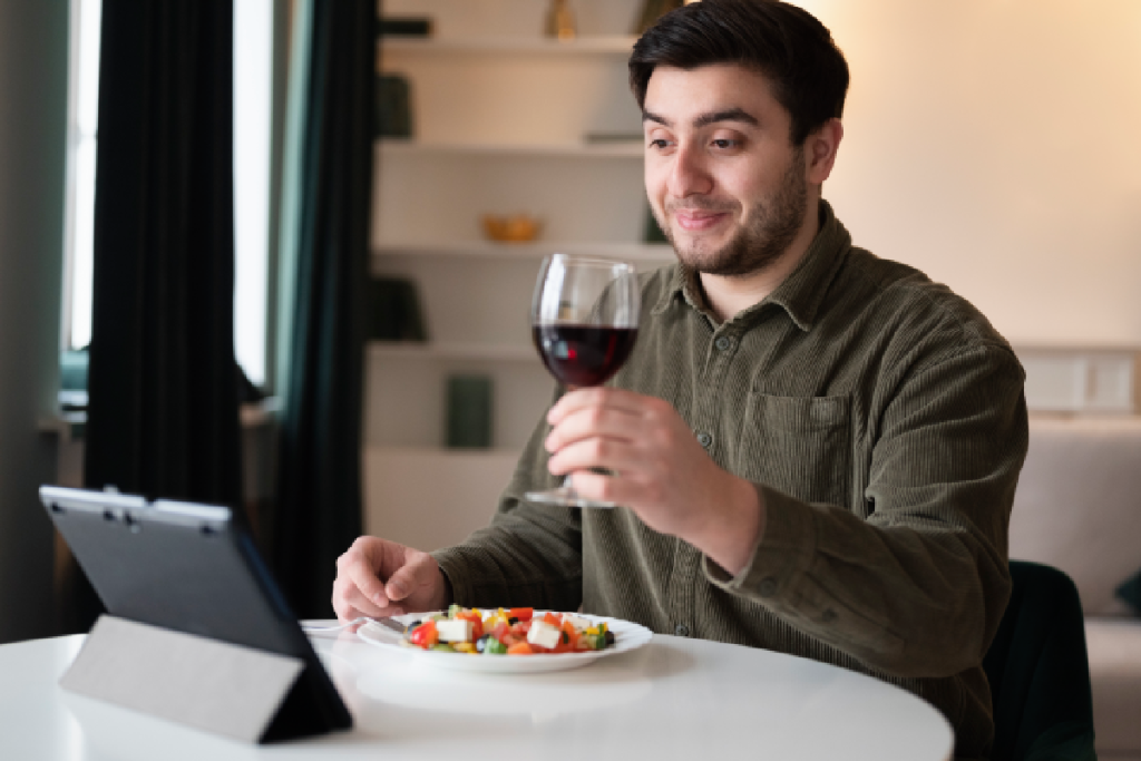 Man enjoying a glass of wine in hotel