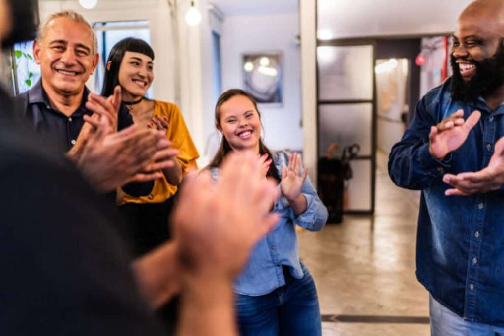 Private party in a hotel with people applauding one person