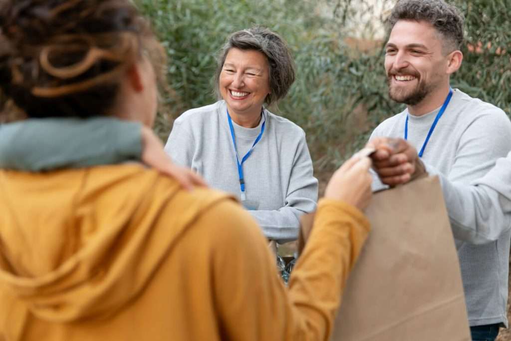 Volunteers with food donations close up