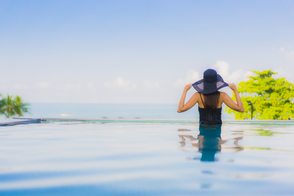 Woman looking over the edge of an infinity pool