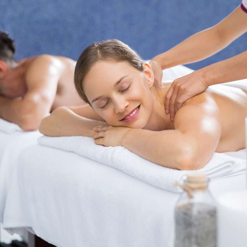 Couple enjoying a couple's treatment at a spa