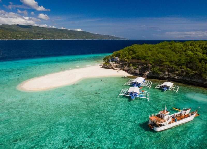 An aerial perspective of the Sumilon island beach landing near Oslob, Cebu, Philippines