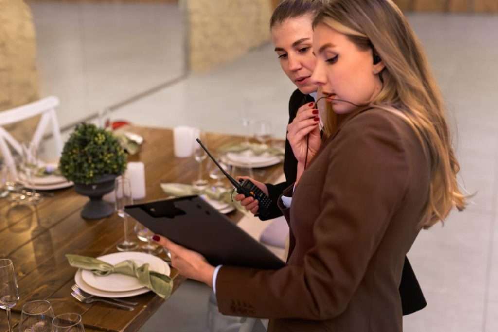 Female wedding planner checking a guest list